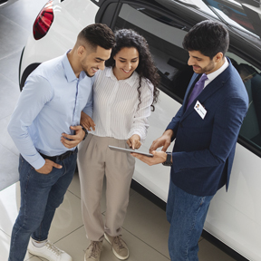 couple at car dealership