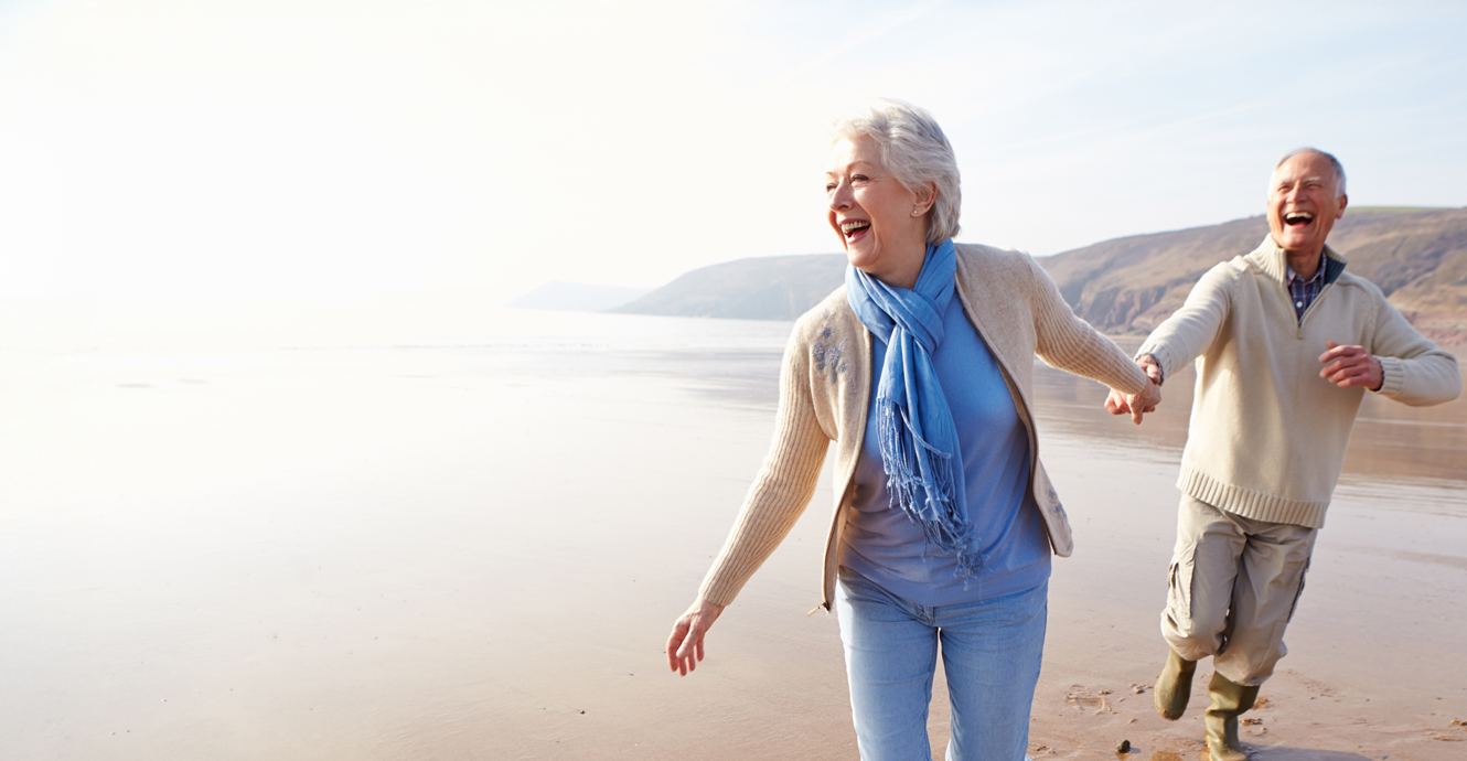 retired couple on beach