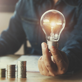 man holding light bulb