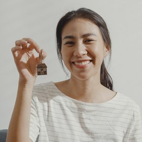 woman holding house key